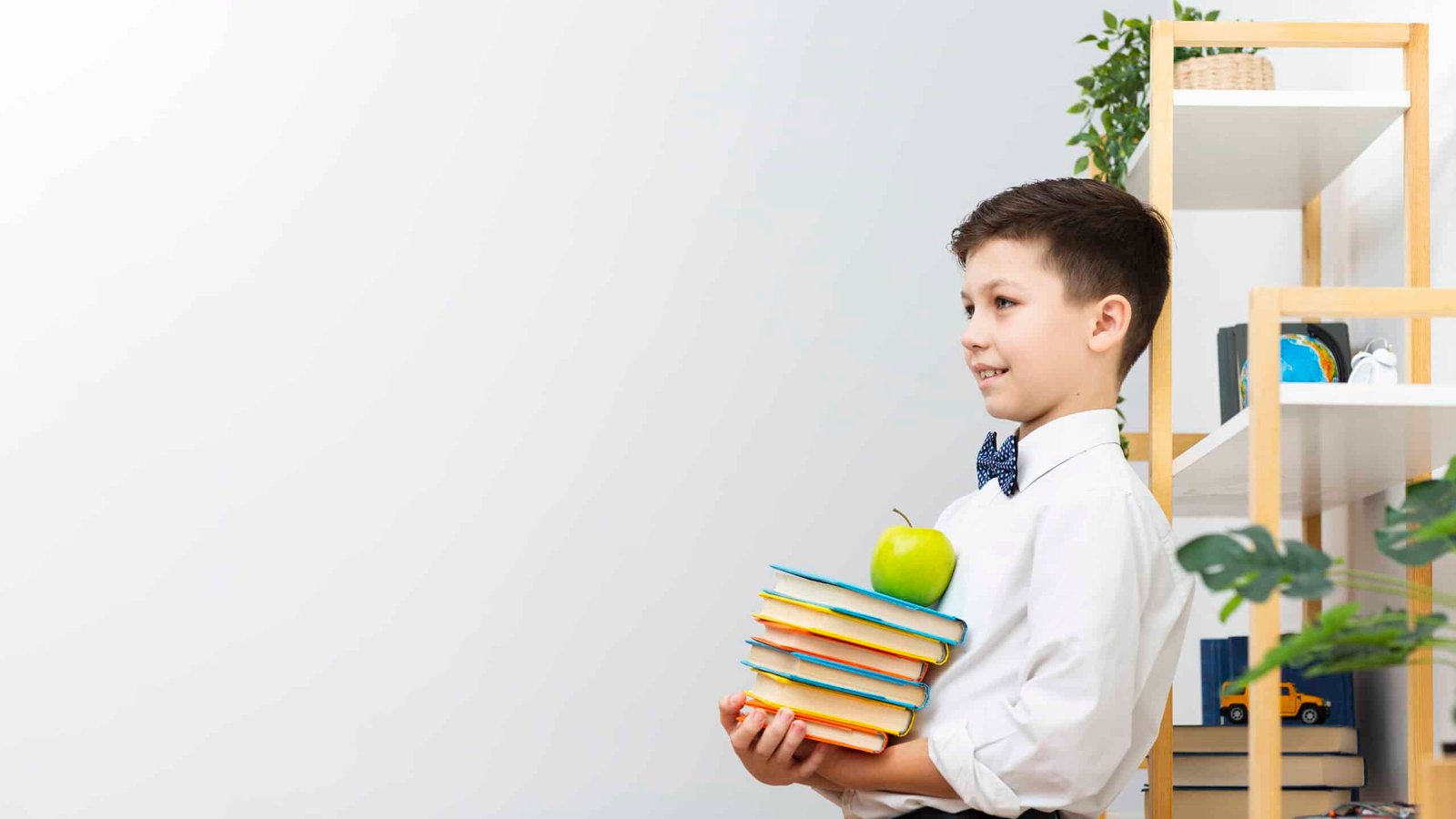copy space boy carrying stack books