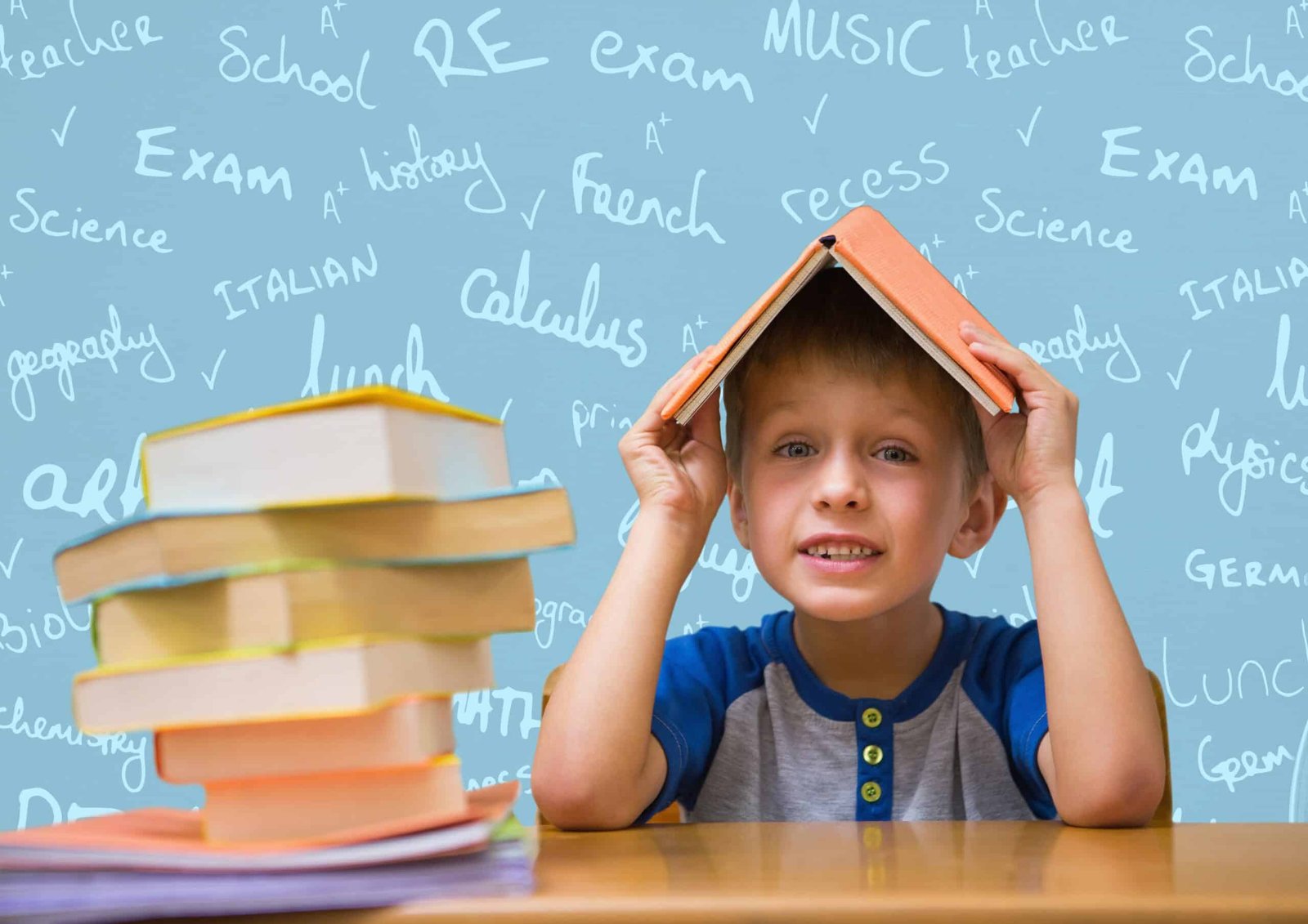 boy with book on head against school doodle background